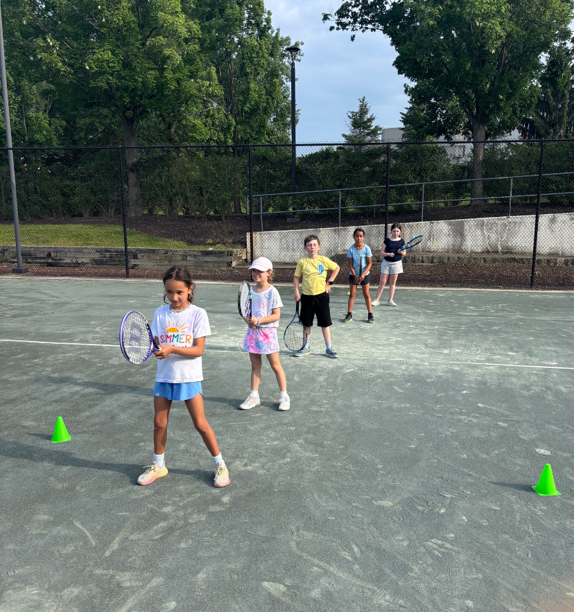 Coach working with a player at the net